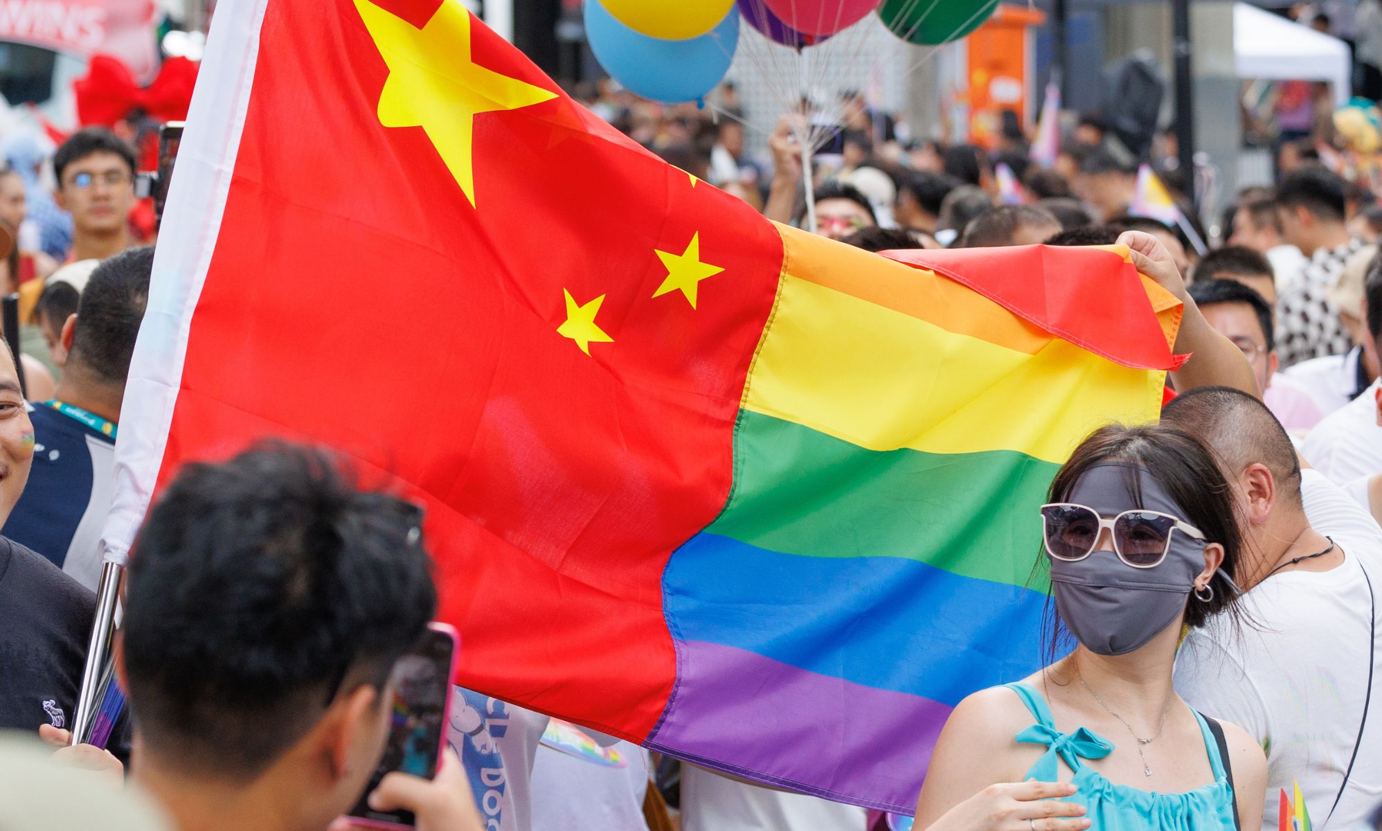 A half-Chinese, half-LGBTQ+ flag.
