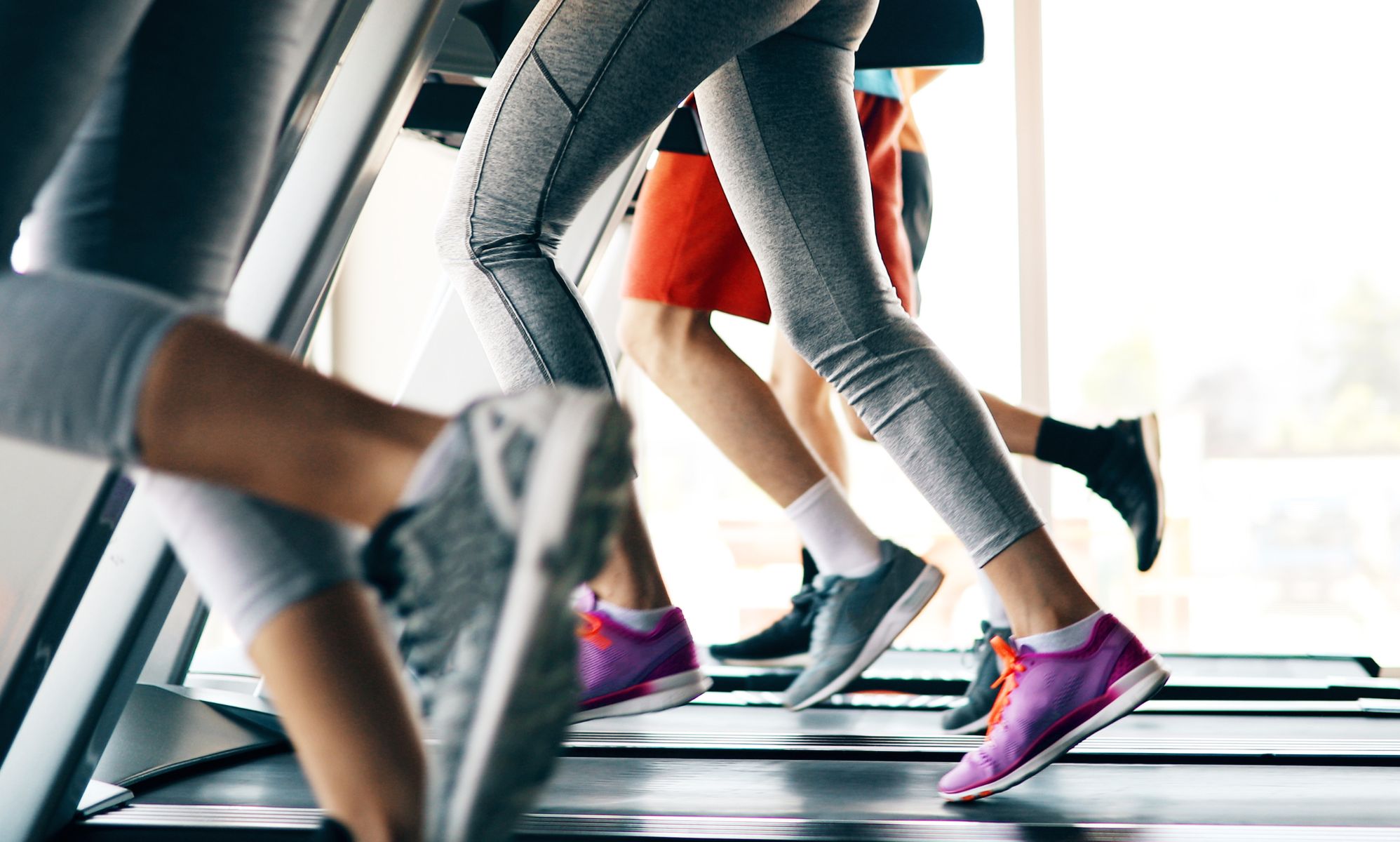 People running on a treadmill.