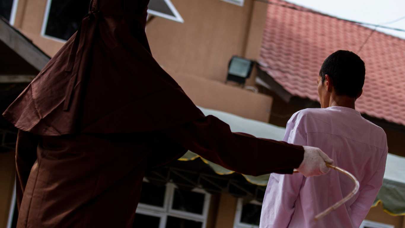 Two young men 'sentenced to public caning for kissing' in Indonesia