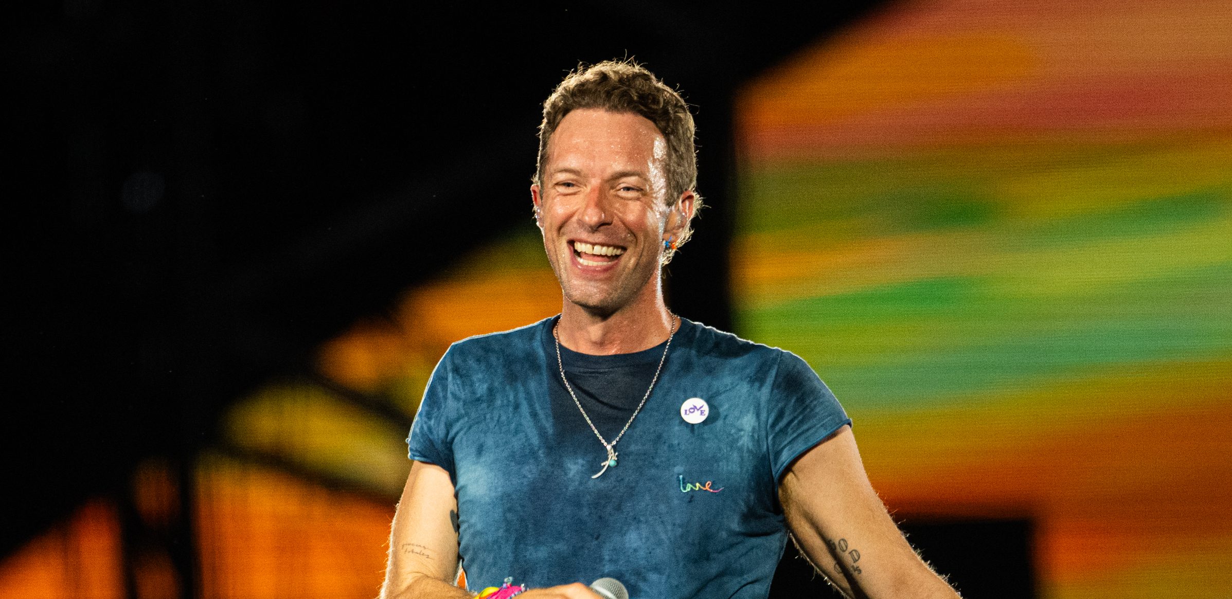 Chris Martin asks fans to put phones down at Coldplay concert - unless you're on Grindr