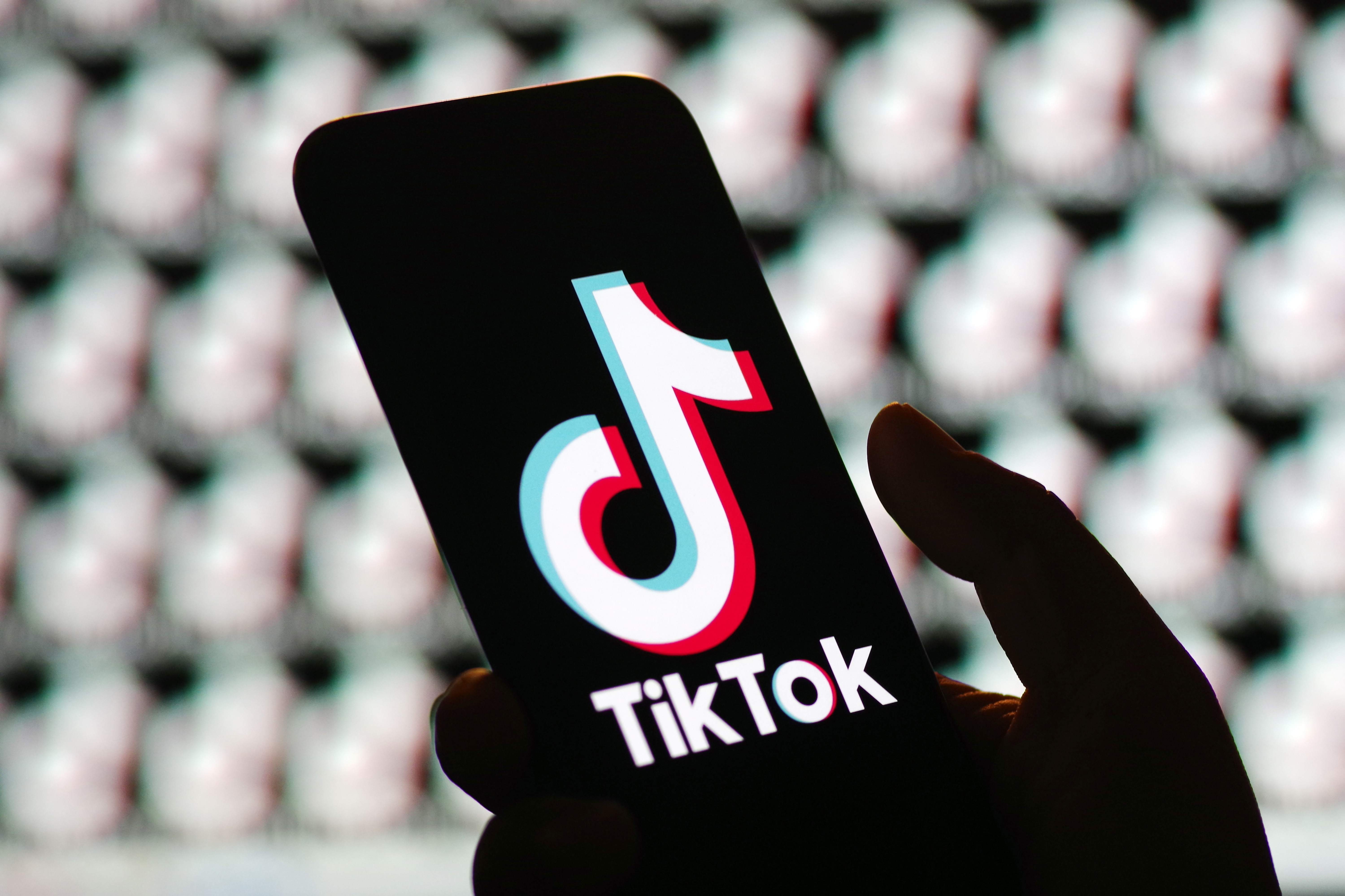 In this photo illustration, the logo of TikTok is displayed on smartphone screen