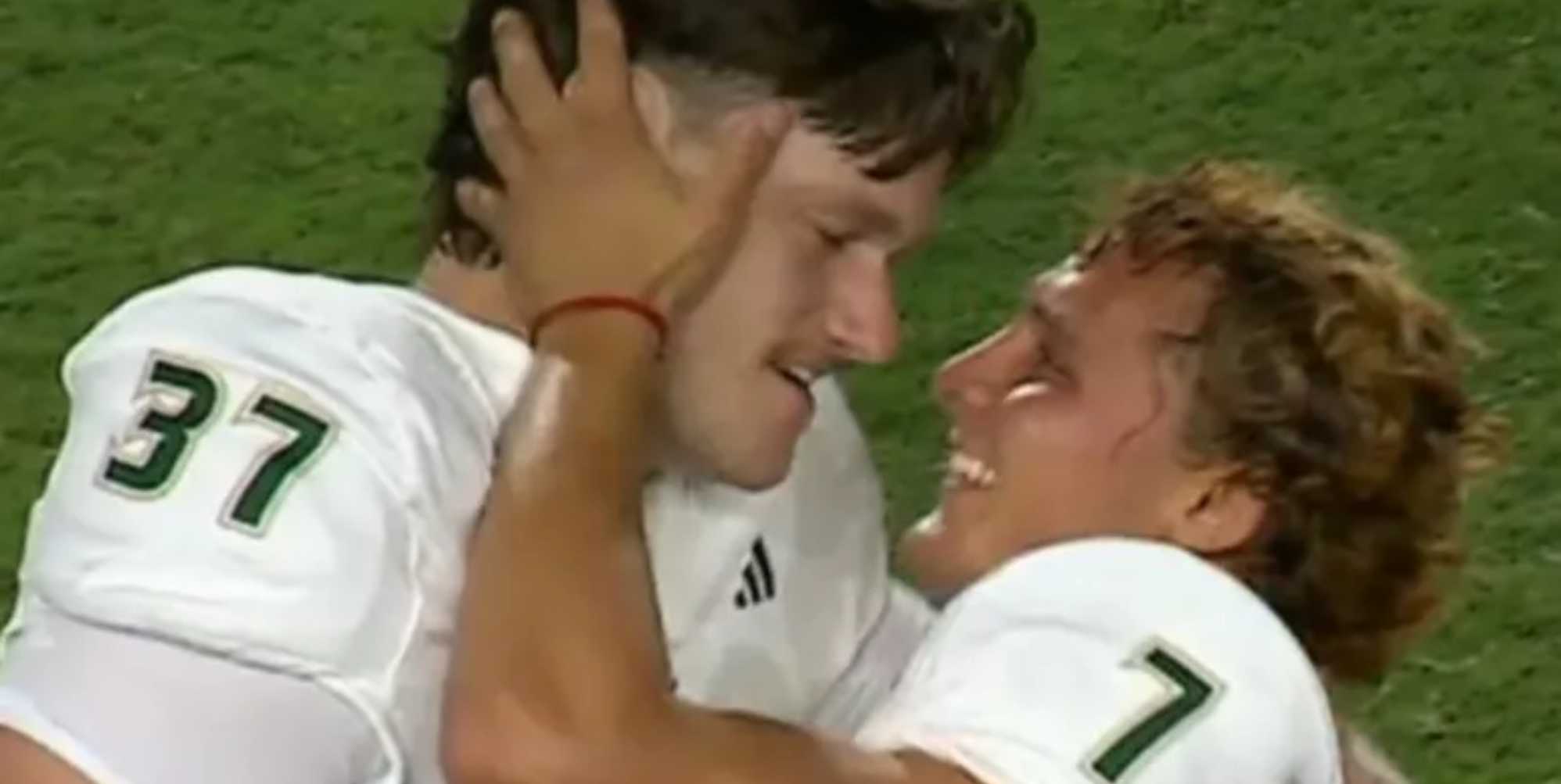 College football star clarifies sexuality after 'homoerotic' photo of him and teammate goes viral