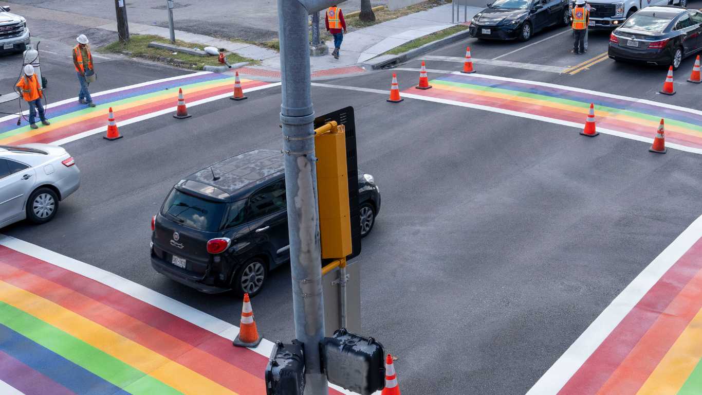 Protestors arrested after standing on rainbow Pride crossing to stop its removal