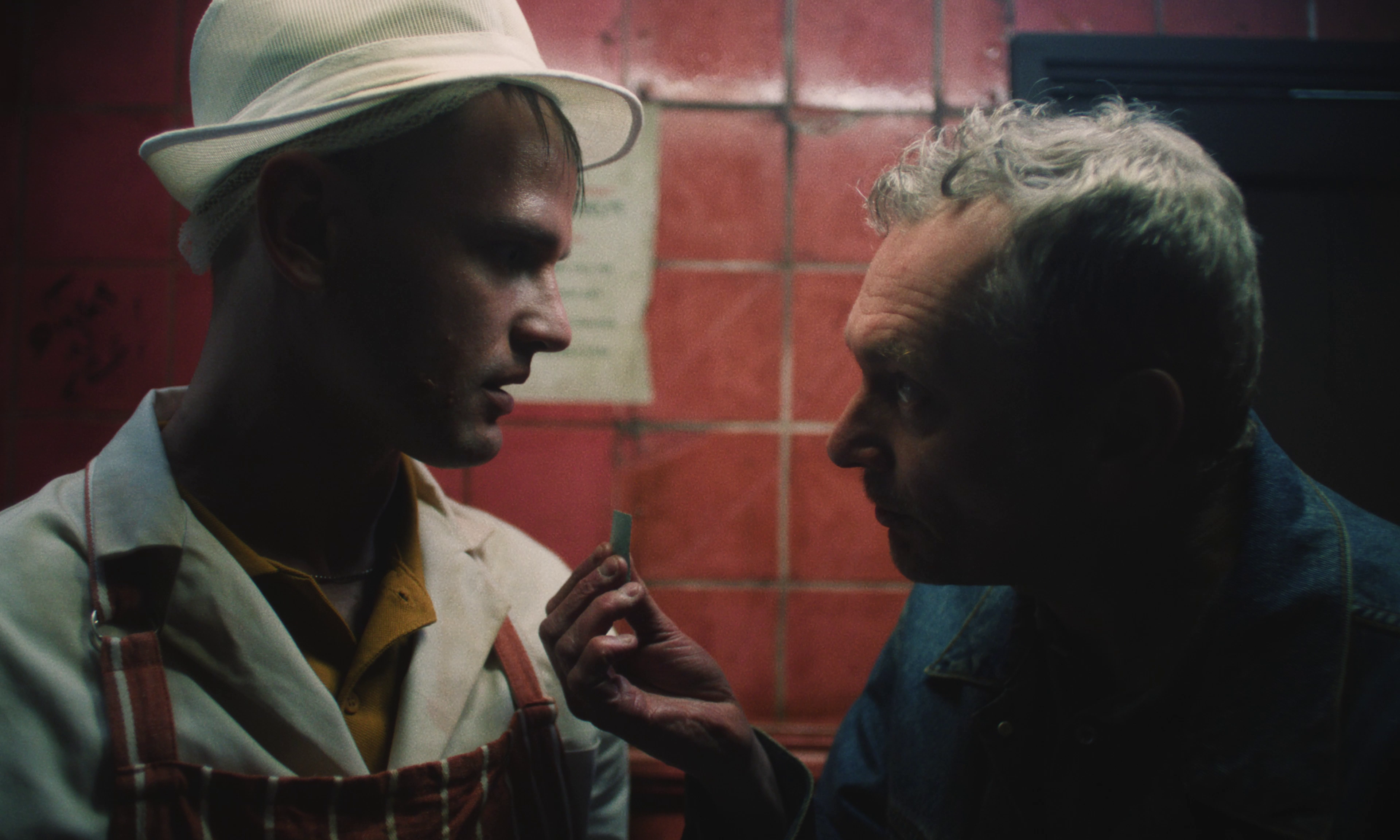 Dominic Weatherill and Michael Hodgson getting close in the bathroom.