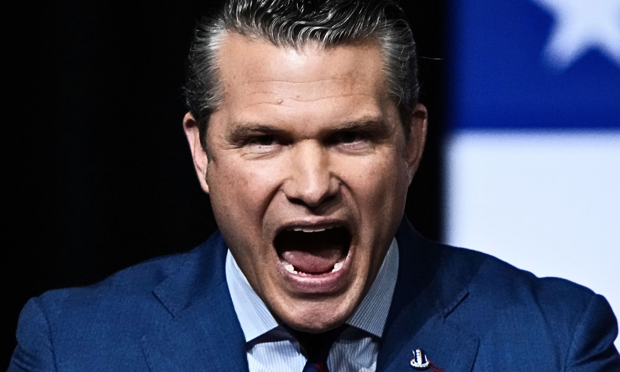 Pete Hegseth, pictured with his mouth open.