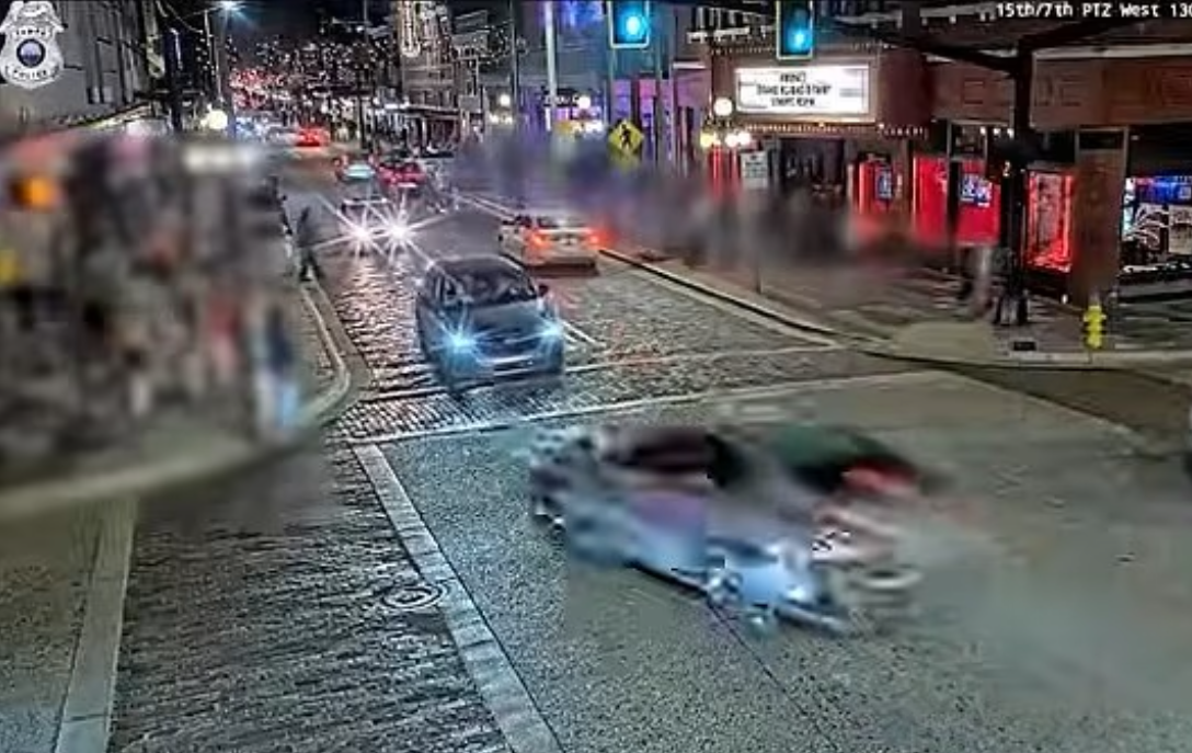 Hundreds attend vigil after car smashes into Tampa gay club, killing four people and injuring 13