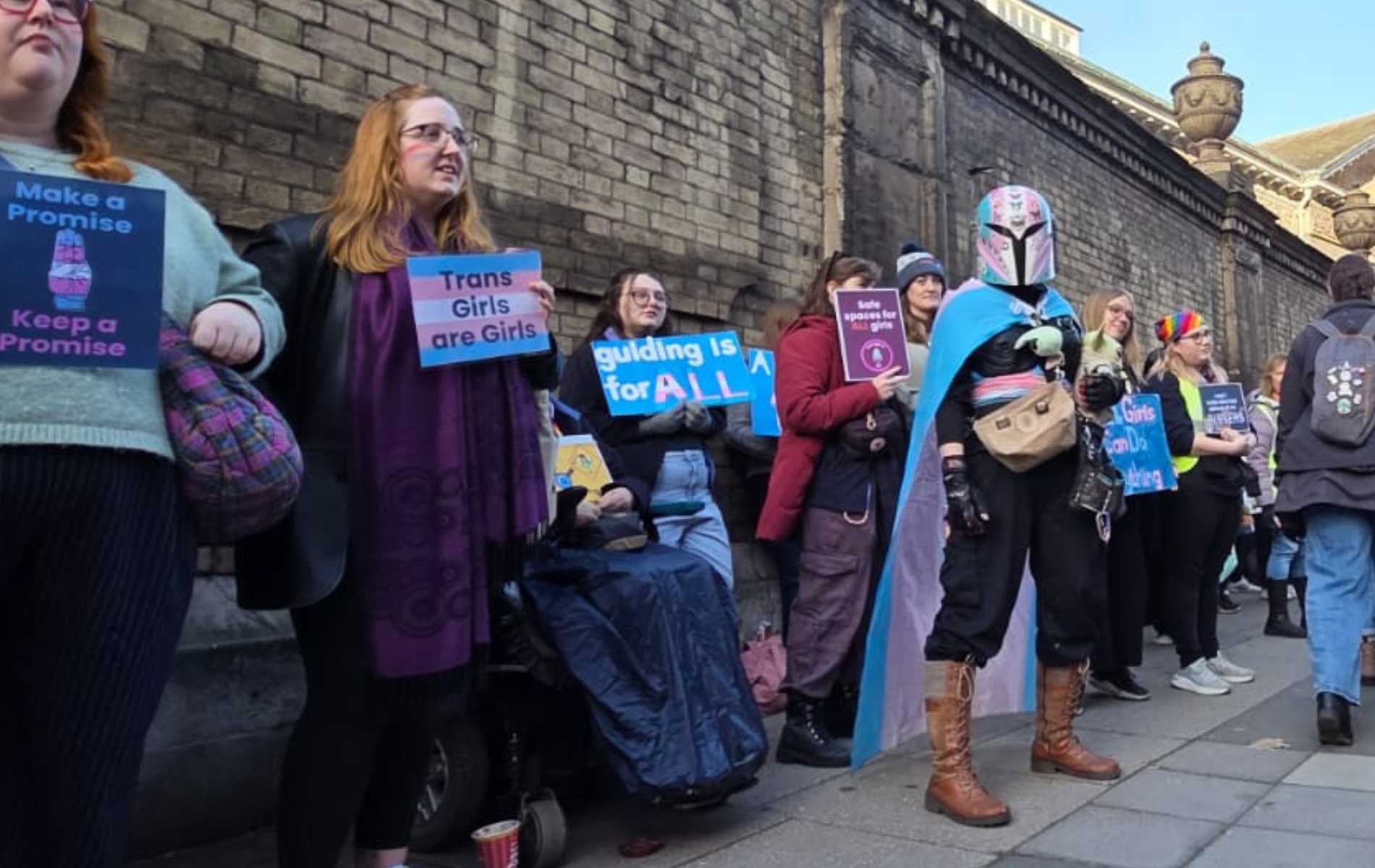 Hundreds gather outside Girlguiding HQ to demand trans ban is reversed: 'Adults debate, children bleed'