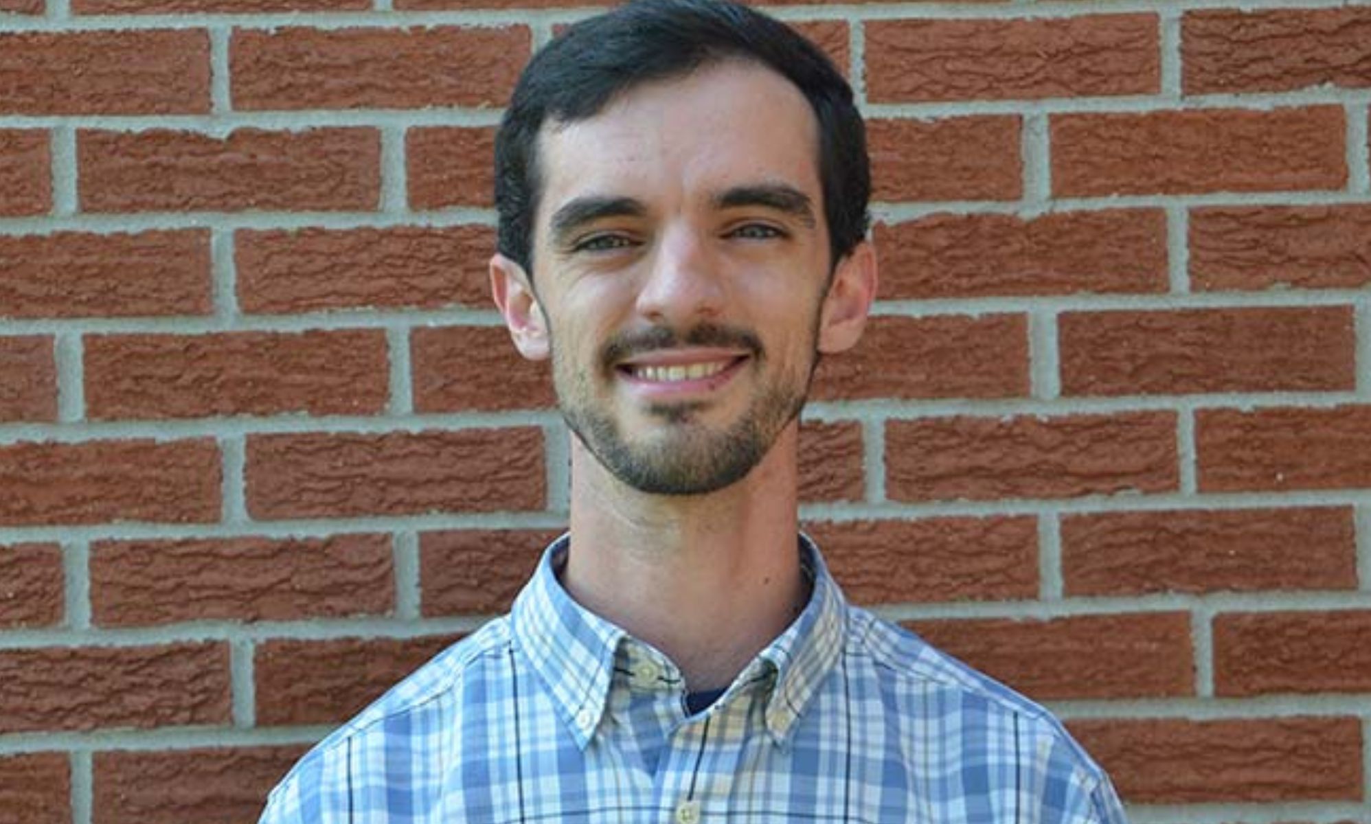 A portrait image of John Kluge.