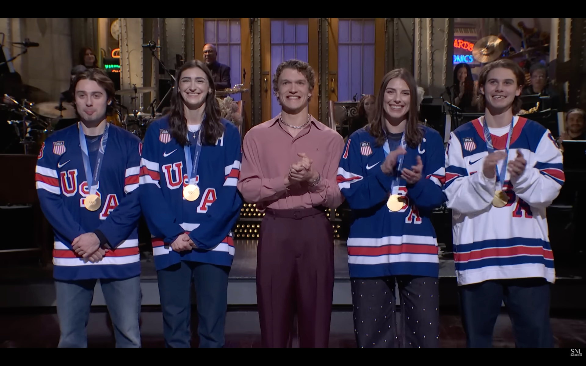 On SNL: Quinn Hughes, Megan Keller, Connor Storrie, Hilary Knight and Jack Hughes.